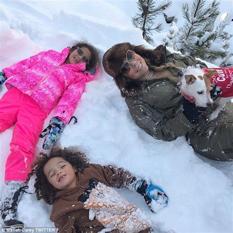 Mariah Carey rocks Dior snowboots while sledding in Aspen